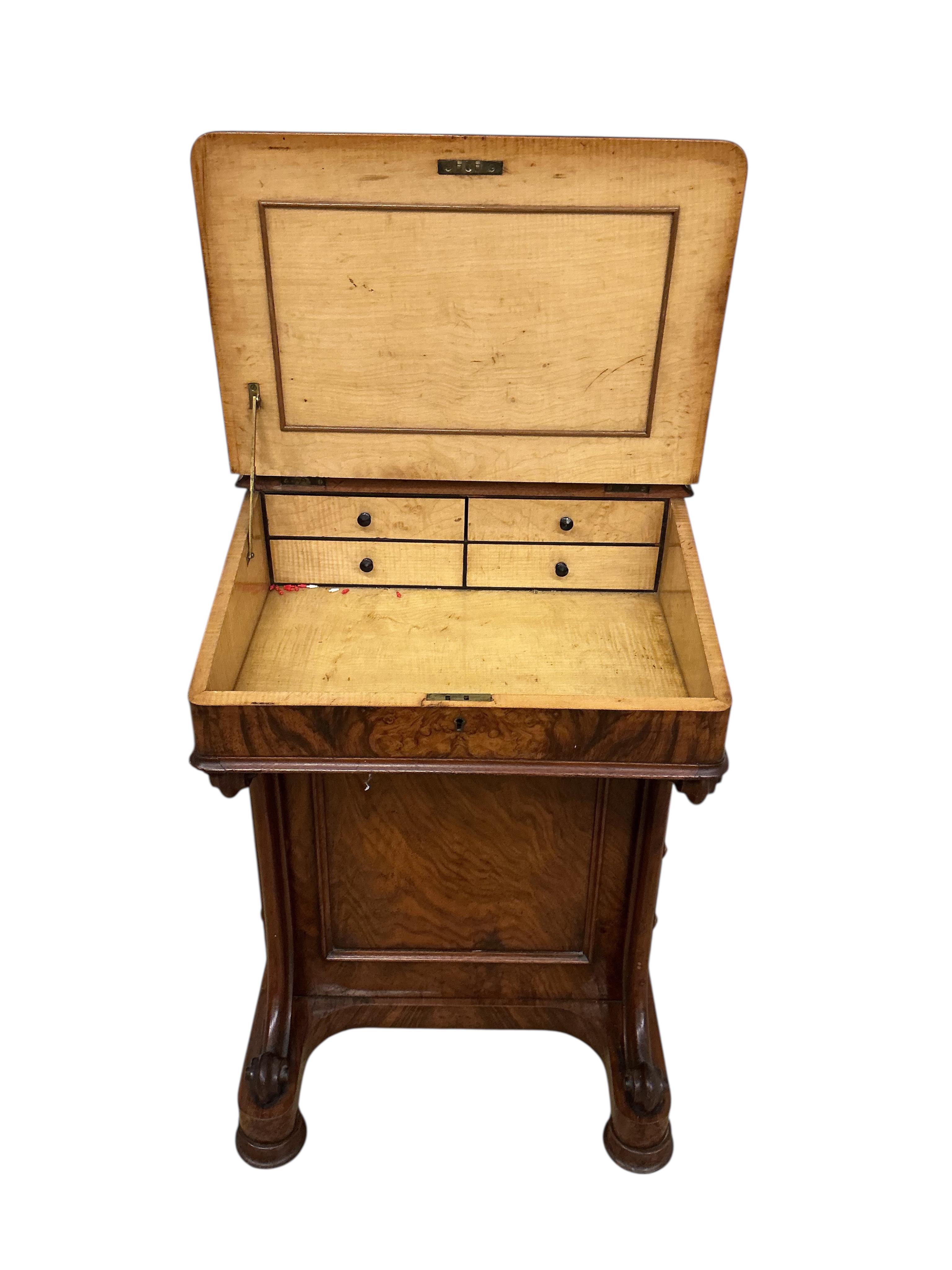 A Victorian figured walnut Davenport, lacks superstructure, width 53cm, depth 53cm, height 81cm